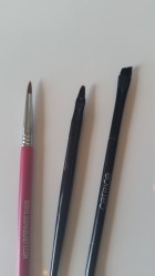 L-R: Sigma rounded/pointed eyeliner brush. Rimmel flat tipped brush, and Catrice's slanted brush.